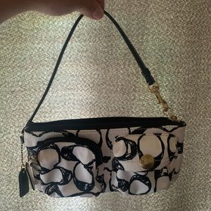 Black and white Coach wristlet